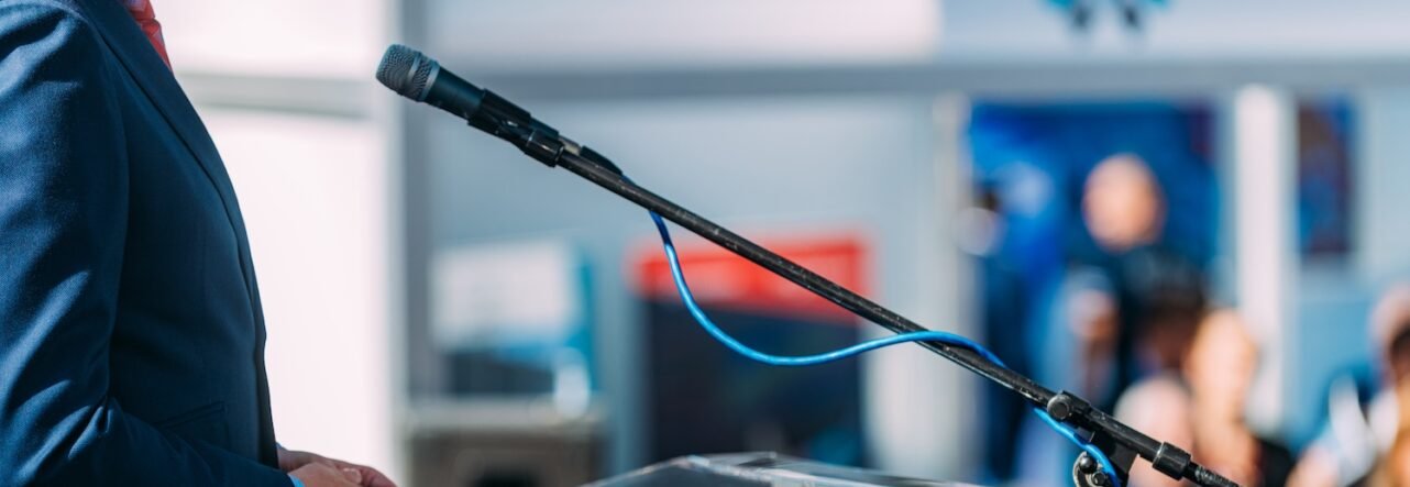 Male Speaker On The Stage